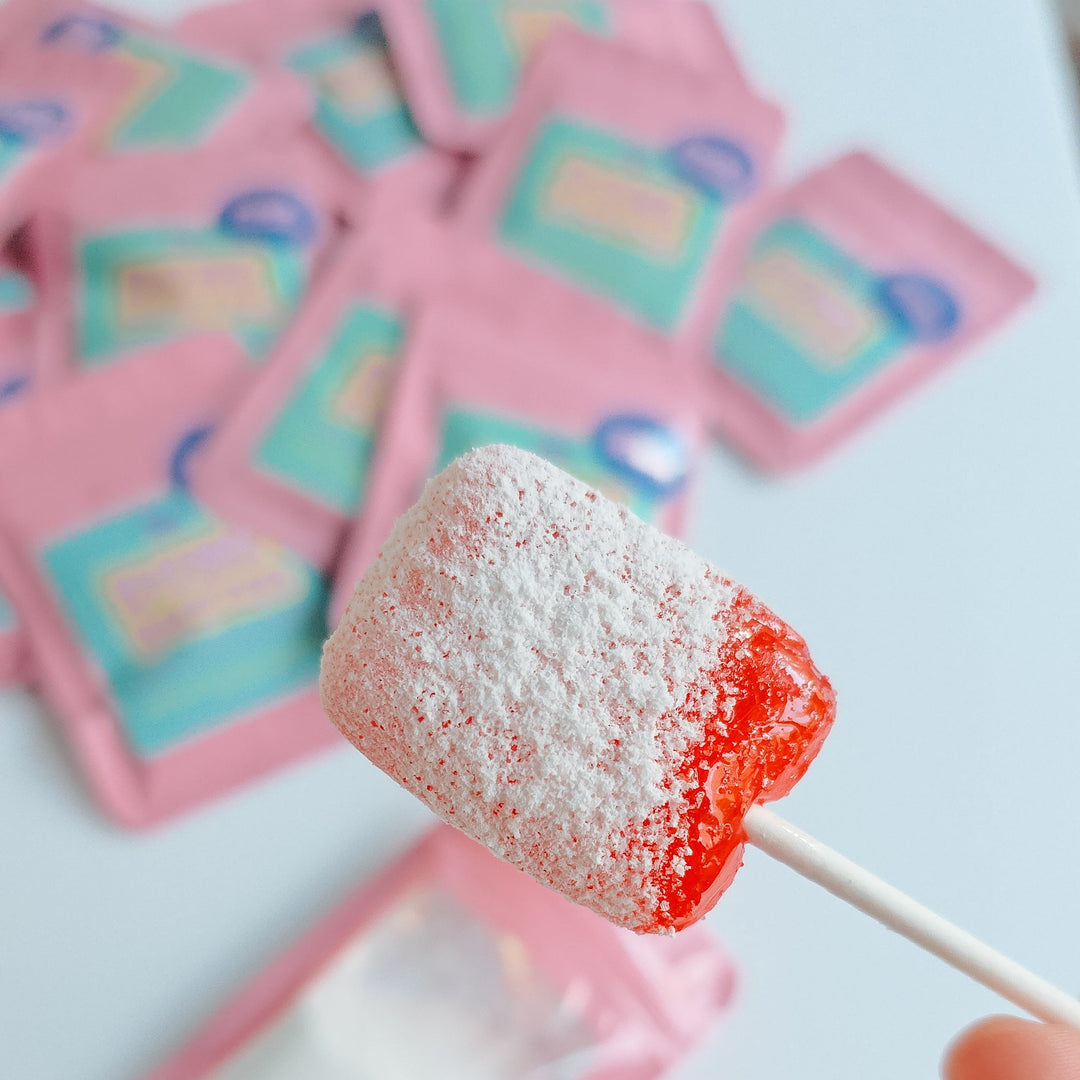 lollipop dipped in sweet or sour candy dip dust