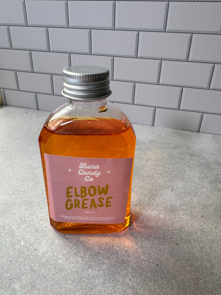 Luna Candy Peach Drink Mix labeled Elbow Grease