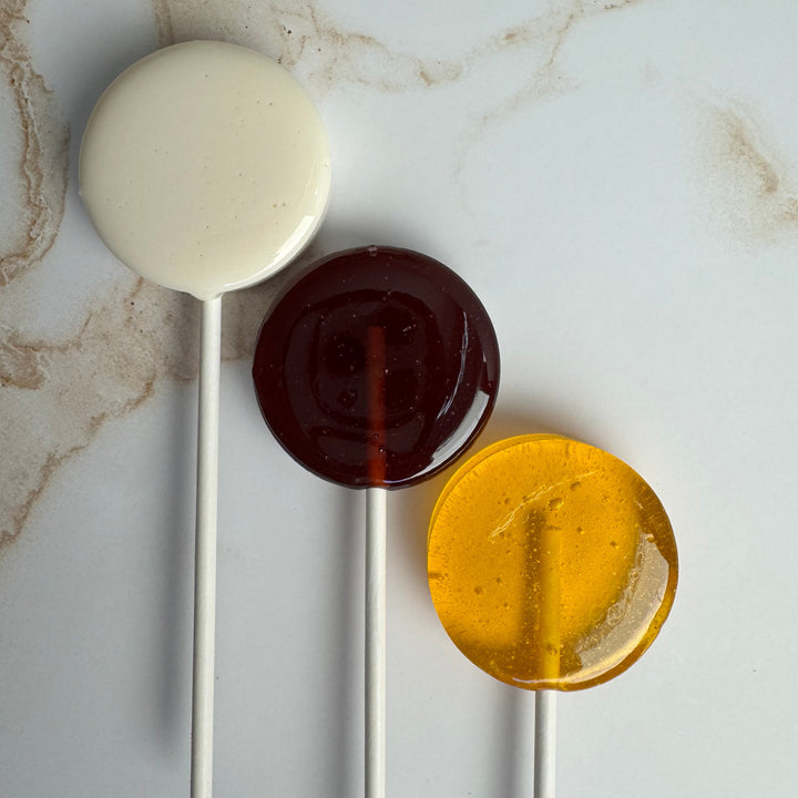 Honey Bee baby shower lollipops packaged in a personalized favor set