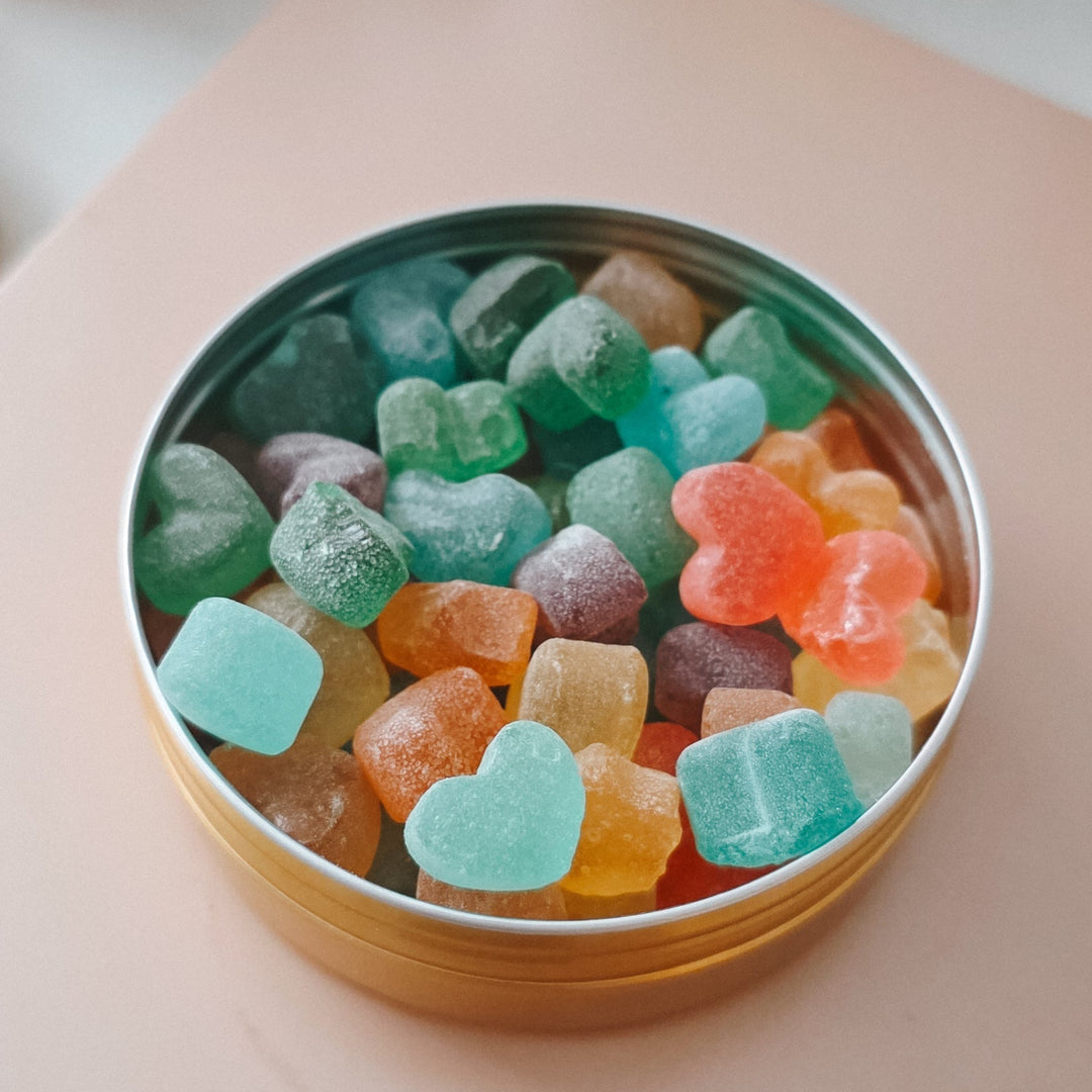 Tin of colorful candy bears in a candy tin