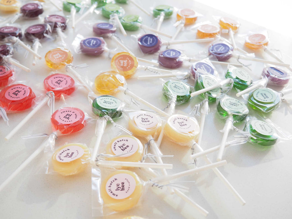 Colorful assortment of Luna Candy Co. best-selling gourmet lollipops in a variety of flavors