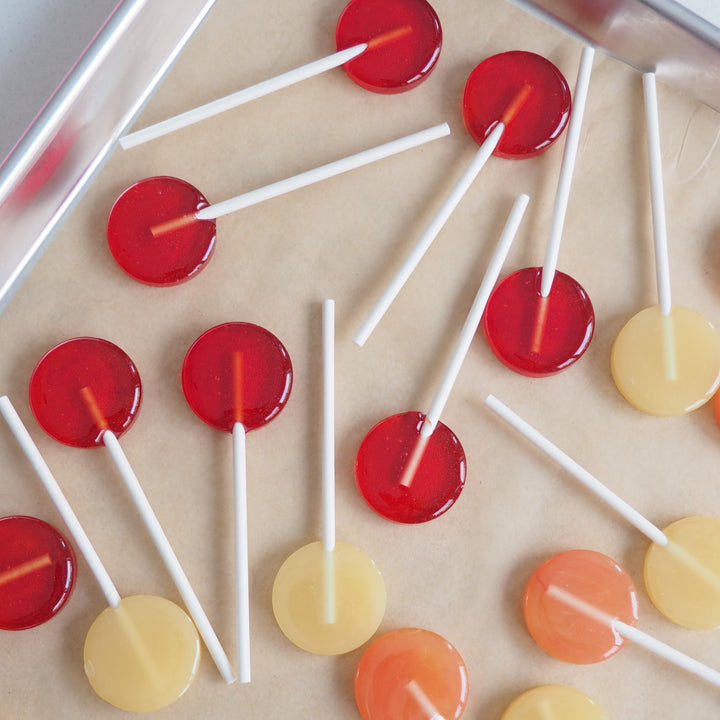 Luna Candy Co. handmade gourmet lollipops close up showing bold colors and glossy finish