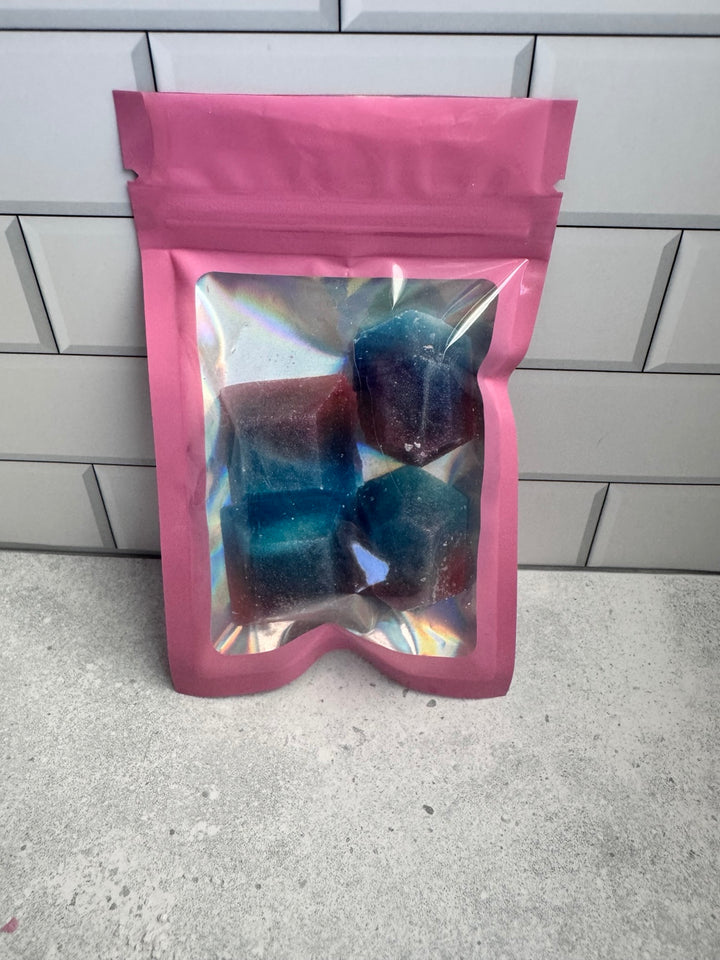 Four cotton candy and strawberry kohakutou candies packaged in a pink holographic pouch
